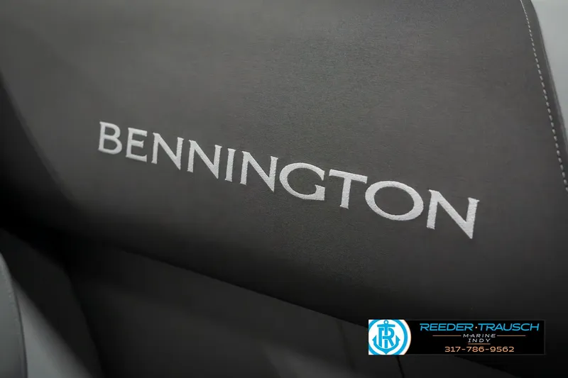 Slide: The Image of Bennington 22 SLSE 2025 boat seat with logo, featuring sleek black upholstery. - 41