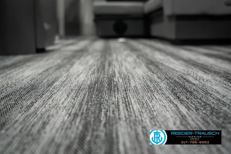 Slide: The Image of Close-up of 2025 Bennington 22 SLSE interior flooring with textured design. - 45
