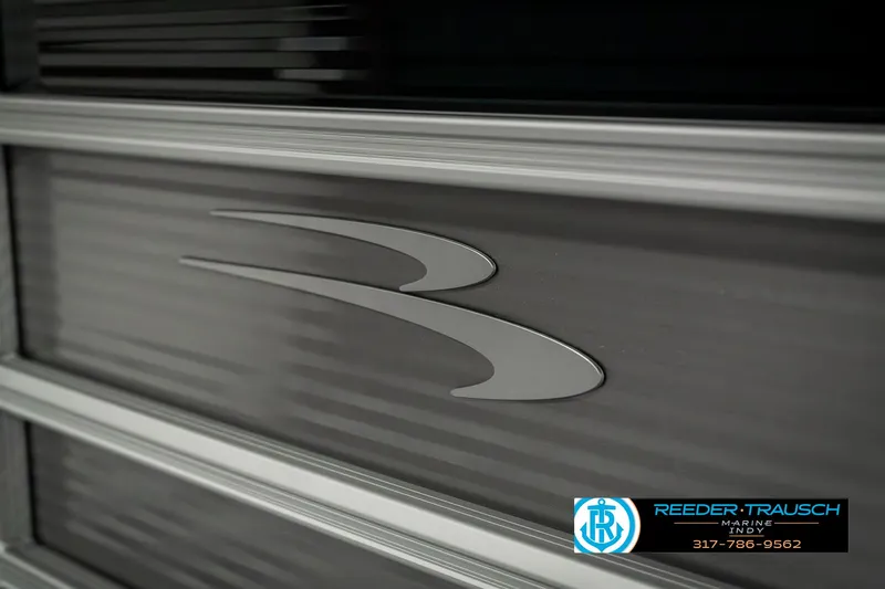 Slide: The Image of 2025 Bennington 22 SLSE boat logo on sleek metallic surface. - 46