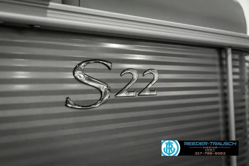 Slide: The Image of 2025 Bennington 22 SLSE boat with S22 emblem, Reeder-Trausch Marine logo. - 48