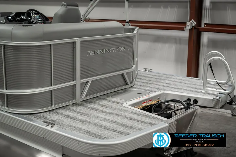 Slide: The Image of 2025 Bennington 22 SLSE pontoon boat interior with gray seating and deck details. - 49
