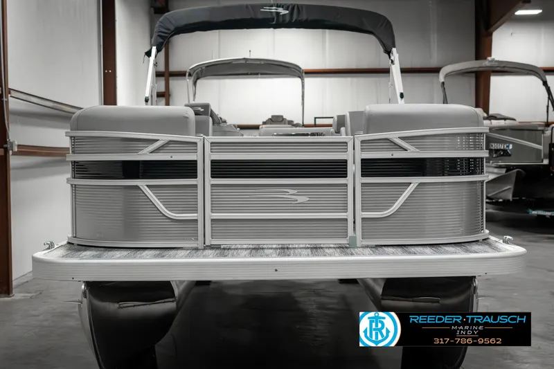 Slide: The Image of 2025 Bennington 22 SLSE pontoon boat in showroom, front view. - 5
