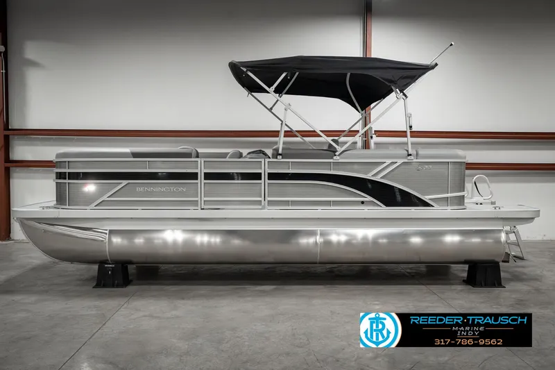 Slide: The Image of 2025 Bennington 22 SLSE pontoon boat with canopy in showroom. - 8