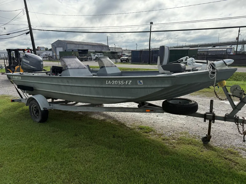 Slide: The Image of 2012 Alweld 1960VVSC Bay boat on trailer, parked outdoors. - 4