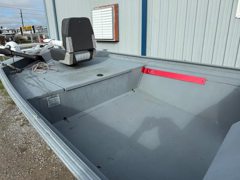 Slide: The Image of 2012 Alweld 1960VVSC Bay boat interior, gray seating, and spacious deck. - 7