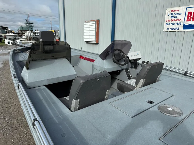 Slide: The Image of 2012 Alweld 1960VVSC Bay boat interior with steering console and seating. - 9