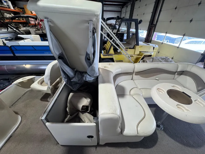 Slide: The Image of 2006 Godfrey Sweetwater 2186 DF pontoon boat interior with storage compartment open. - 13