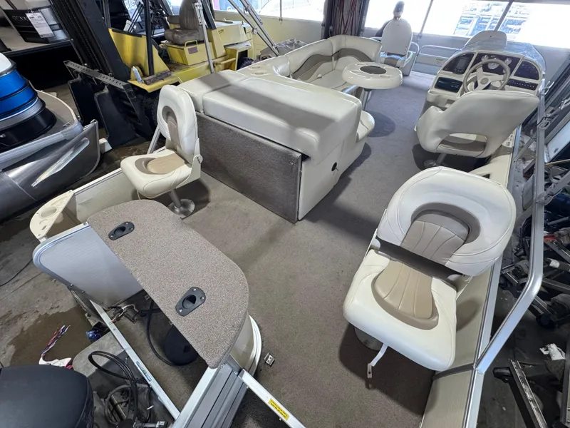 Slide: The Image of 2006 Godfrey Sweetwater 2186 DF pontoon boat interior with seating and steering console. - 14