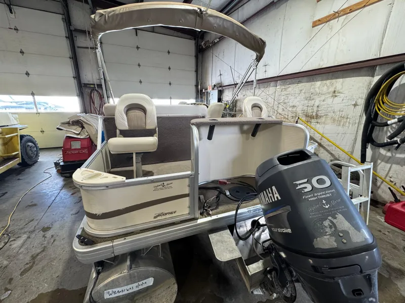 Slide: The Image of 2006 Godfrey Sweetwater 2186 DF pontoon boat with Yamaha 50 engine in garage. - 16
