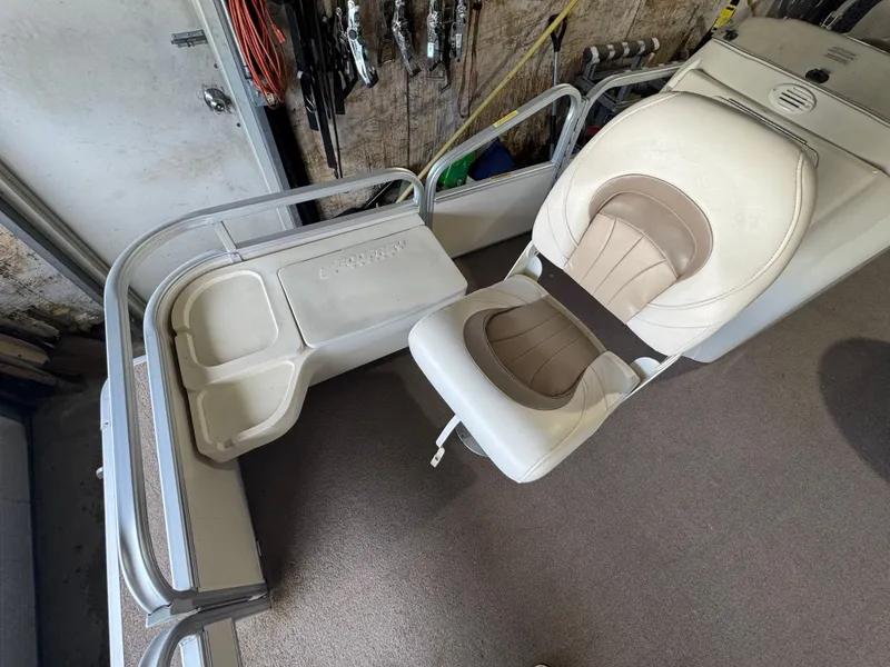 Slide: The Image of 2006 Godfrey Sweetwater 2186 DF boat interior with seating and storage compartments. - 3