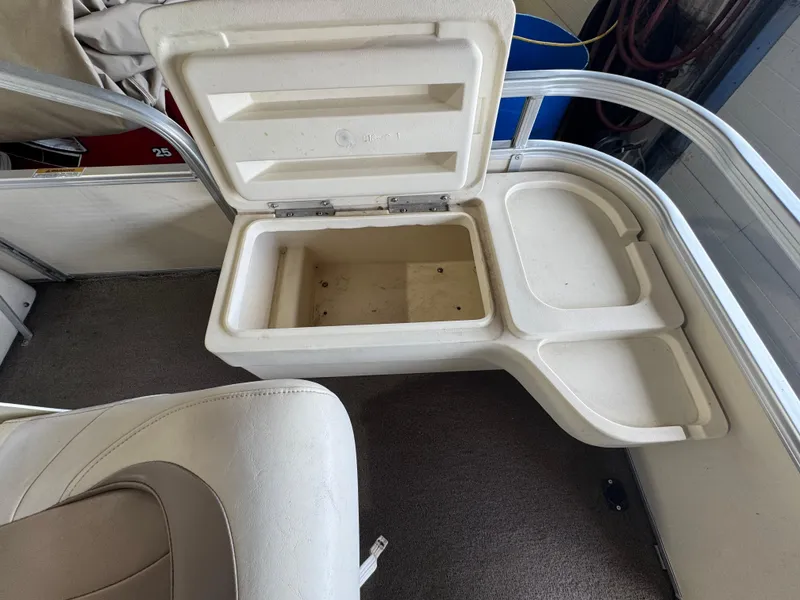 Slide: The Image of 2006 Godfrey Sweetwater 2186 DF boat seat with open storage compartment. - 5