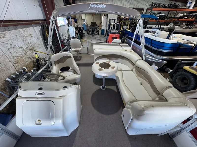 Slide: The Image of 2006 Godfrey Sweetwater 2186 DF pontoon boat interior with seating and helm. - 6