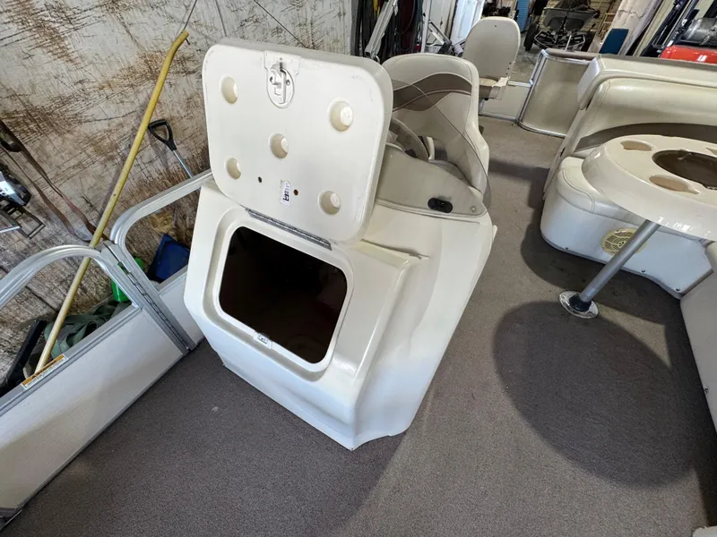 Slide: The Image of 2006 Godfrey Sweetwater 2186 DF boat interior with open storage compartment. - 8