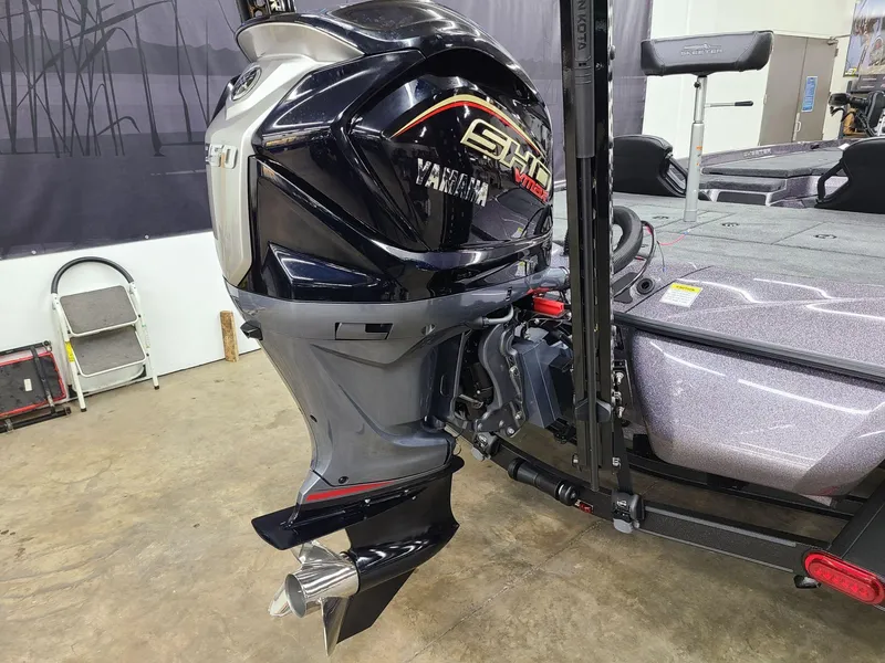 Slide: The Image of 2024 Skeeter ZXR 20 boat with Yamaha SHO outboard motor in a garage setting. - 3