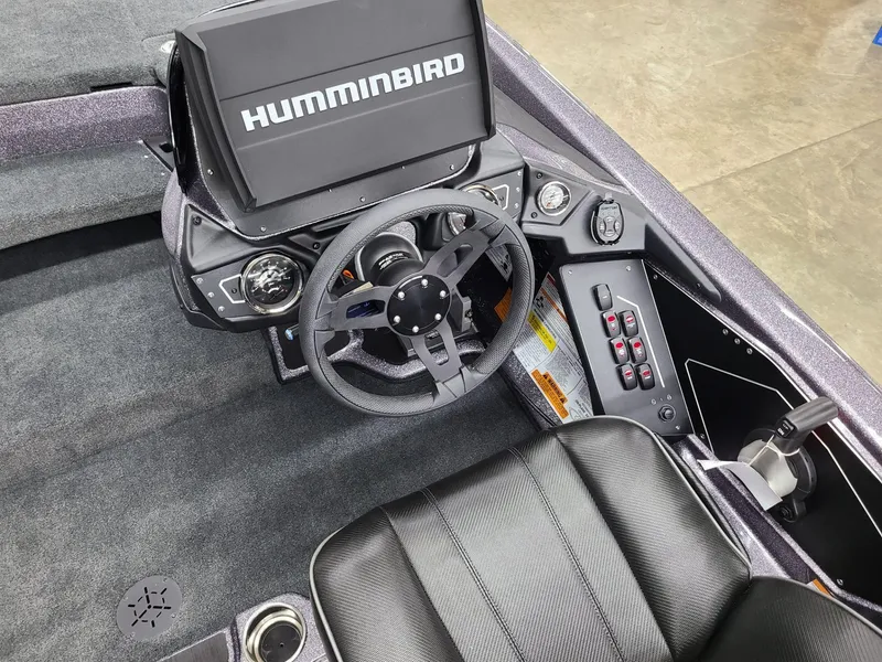 Slide: The Image of 2024 Skeeter ZXR 20 boat cockpit with Humminbird electronics and sleek steering wheel. - 6