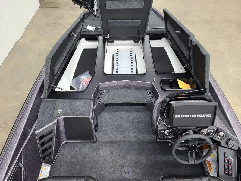 Slide: The Image of 2024 Skeeter ZXR 20 boat interior with Humminbird electronics and storage compartments. - 8