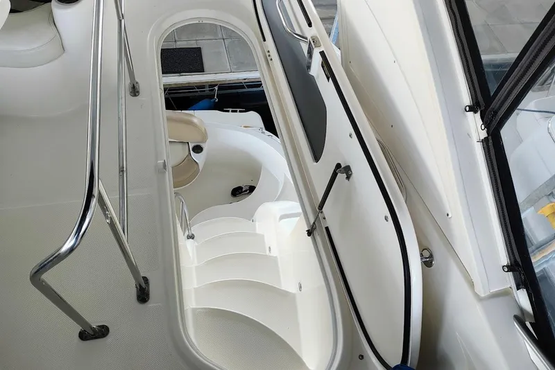 Slide: The Image of Staircase on a 2007 Meridian 341 Sedan yacht, featuring sleek design and stainless steel railings. - 10