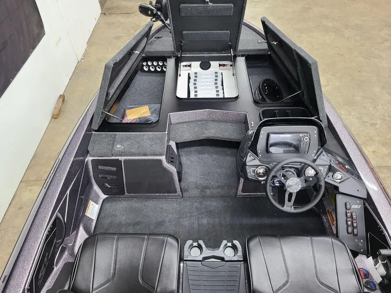 Slide: The Image of 2024 Skeeter ZX 200 boat interior with steering console and seating. - 10