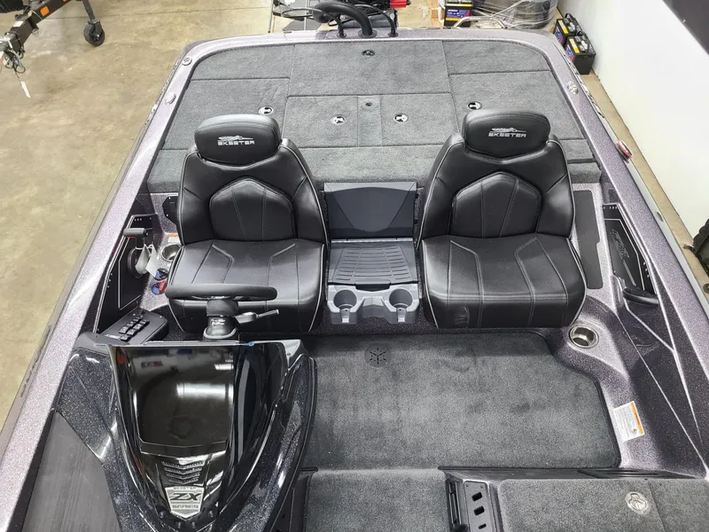 Slide: The Image of 2024 Skeeter ZX 200 boat interior with dual black seats and console. - 11