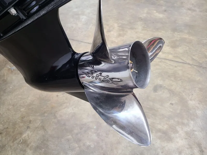 Slide: The Image of 2024 Skeeter ZX 200 boat propeller, shiny metal finish on concrete floor. - 7