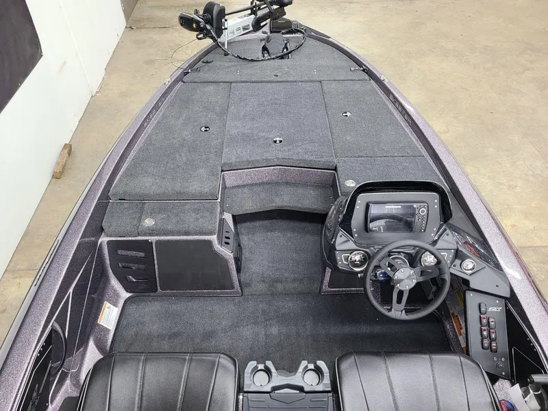 Slide: The Image of 2024 Skeeter ZX 200 boat interior with steering console and seating. - 9