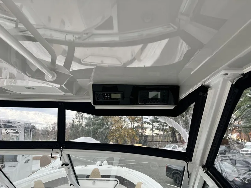 Slide: The Image of Interior view of 2022 Edgewater 262CX boat with electronic controls. - 8