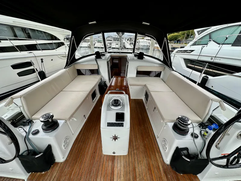 Slide: The Image of 2020 Jeanneau Sun Odyssey 490 yacht cockpit with seating and steering wheel. - 21