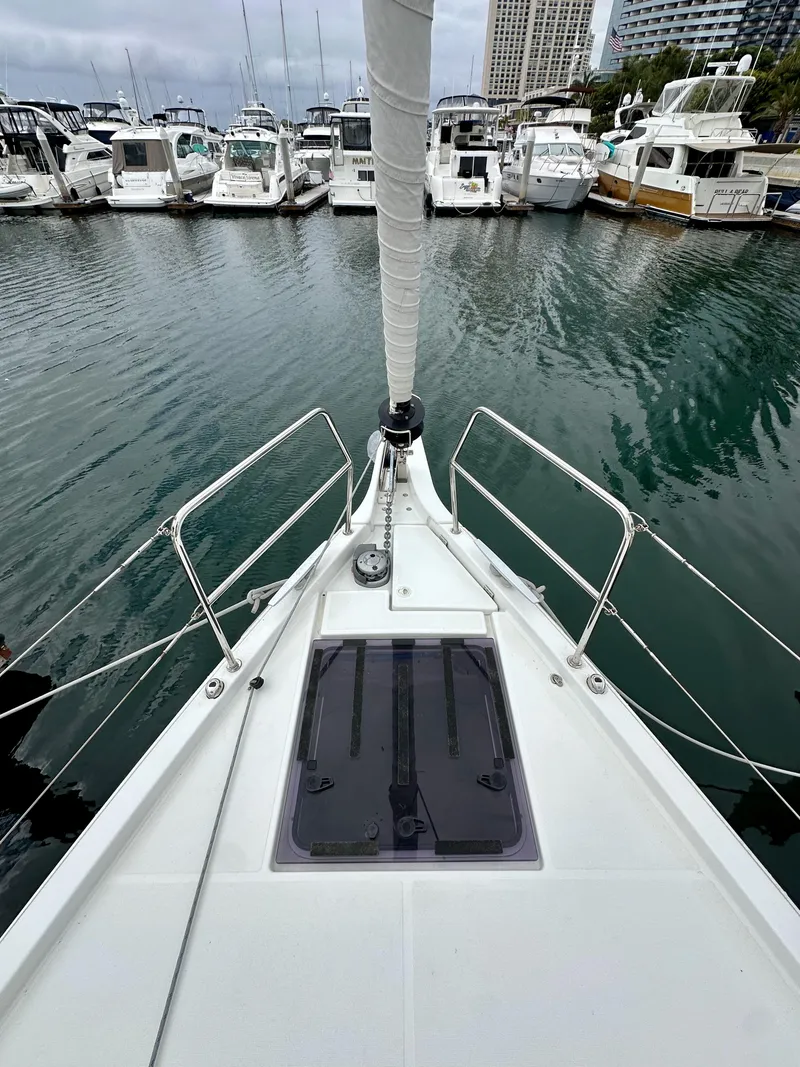 Slide: The Image of Jeanneau Sun Odyssey 490 sailboat docked in marina, 2020 model, view from bow. - 34