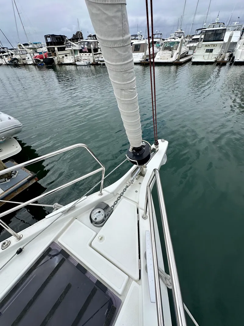 Slide: The Image of Jeanneau Sun Odyssey 490 sailboat docked in marina, 2020 model. - 38