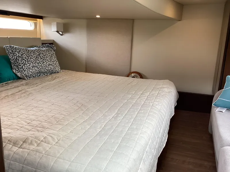 Slide: The Image of Luxurious bedroom interior of 2018 Regal 42 Fly yacht with cozy bedding. - 10