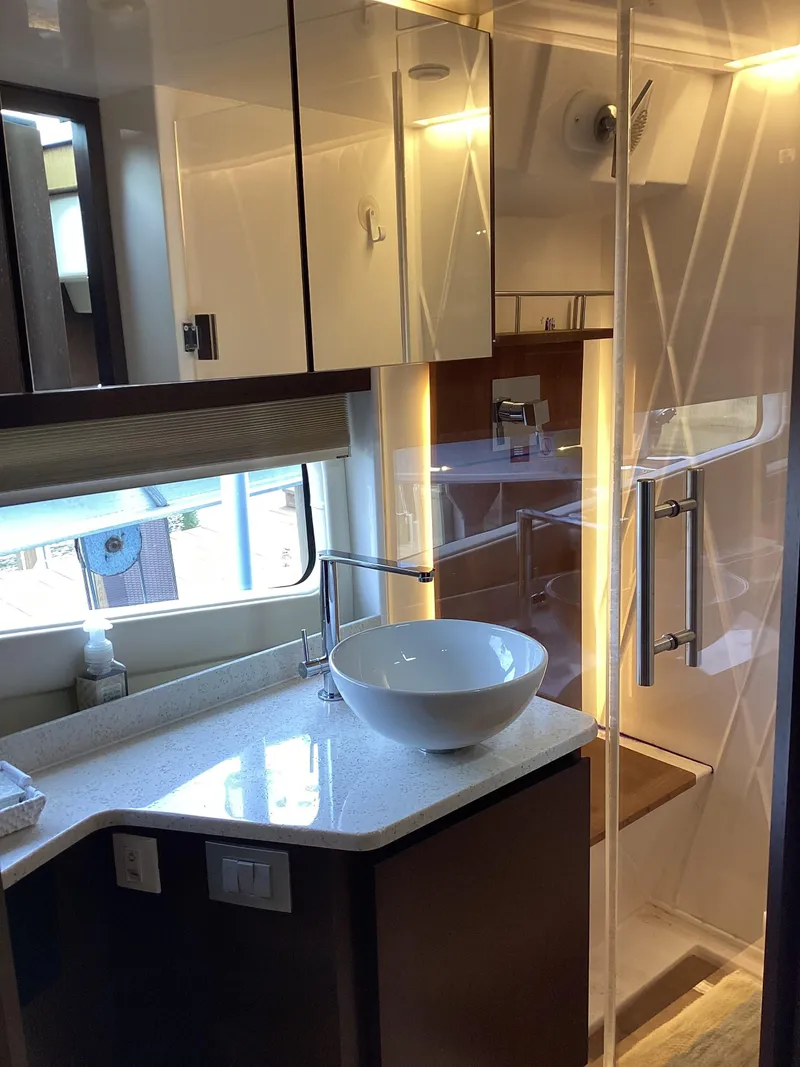 Slide: The Image of Luxurious bathroom in 2018 Regal 42 Fly yacht with modern fixtures and elegant design. - 16