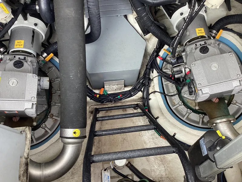 Slide: The Image of Engine room of 2018 Regal 42 Fly yacht, showcasing mechanical components and wiring. - 26