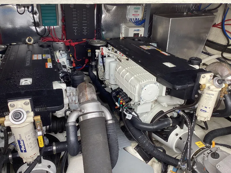 Slide: The Image of Engine room of 2018 Regal 42 Fly yacht with dual engines and mechanical components. - 27