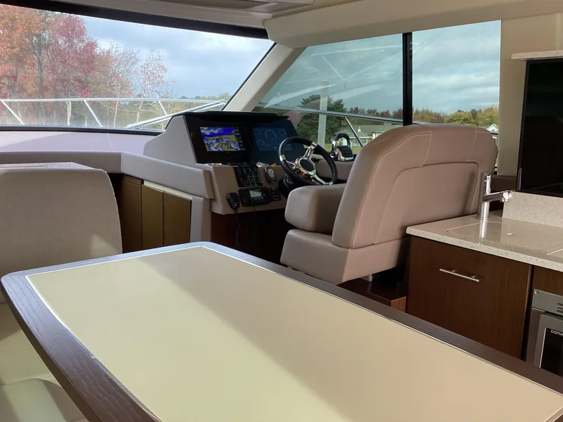 Slide: The Image of Interior of 2018 Regal 42 Fly yacht with modern helm and seating area. - 34
