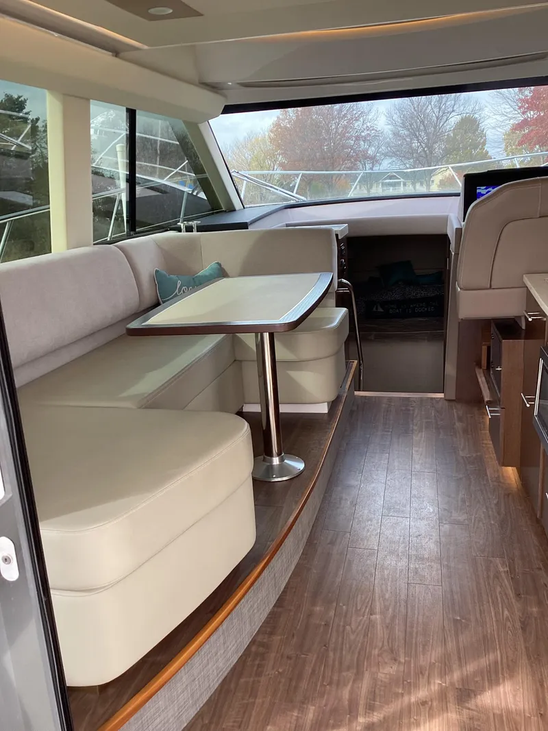 Slide: The Image of Interior of 2018 Regal 42 Fly yacht with elegant seating and dining area. - 36