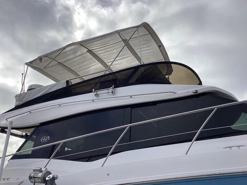 Slide: The Image of 2018 Regal 42 Fly yacht with sleek design and canopy, viewed from below. - 37