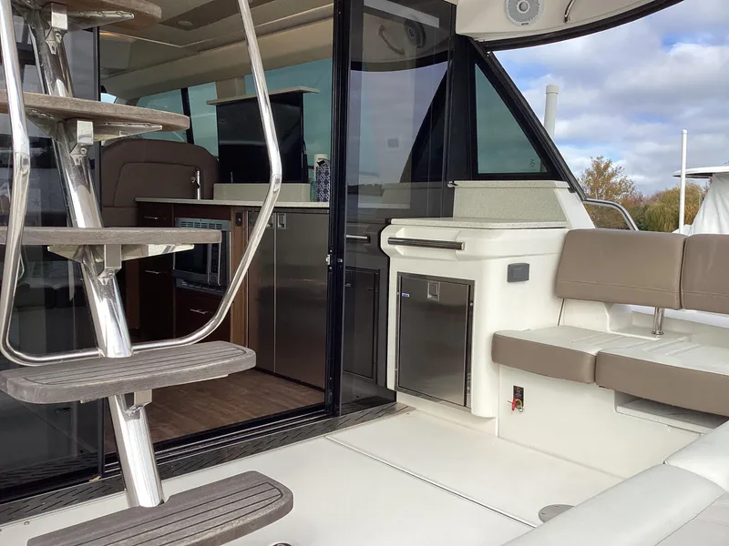 Slide: The Image of 2018 Regal 42 Fly yacht interior with modern seating and sleek design. - 39