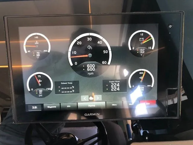 Slide: The Image of Garmin display on 2018 Regal 42 Fly showing engine metrics and gauges. - 42