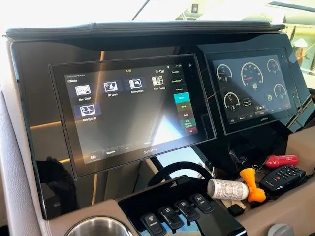 Slide: The Image of Control panel of 2018 Regal 42 Fly yacht with touchscreen displays and navigation instruments. - 43