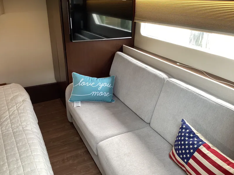 Slide: The Image of Interior of 2018 Regal 42 Fly yacht with cozy sofa and decorative pillows. - 6