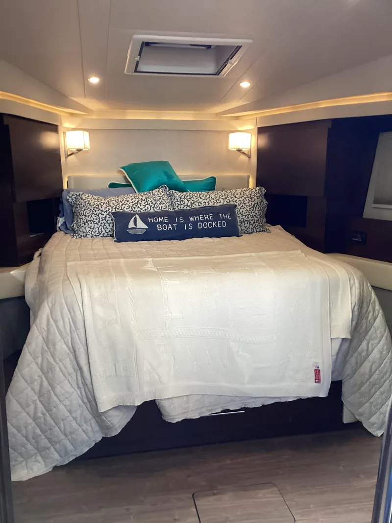 Slide: The Image of Luxurious bedroom interior of 2018 Regal 42 Fly yacht with cozy bedding. - 9