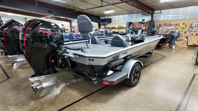Slide: The Image of 2024 Vexus AVX1980 boat with Mercury engine displayed in showroom. - 5