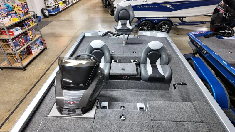 Slide: The Image of 2024 Vexus AVX1980 boat interior with seating and console in showroom. - 7