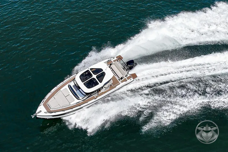 Slide: The Image of Navan S30 2025 luxury boat cruising on open water, aerial view. - 10