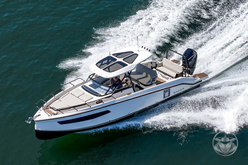 Slide: The Image of Navan S30 2025 boat cruising swiftly on open water, showcasing sleek design and performance. - 11