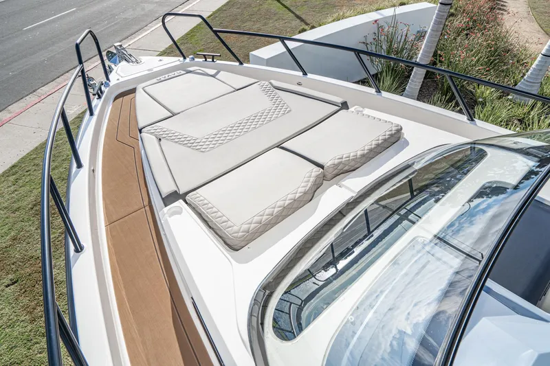 Slide: The Image of 2025 Navan S30 boat deck with cushioned seating and sleek design. - 13
