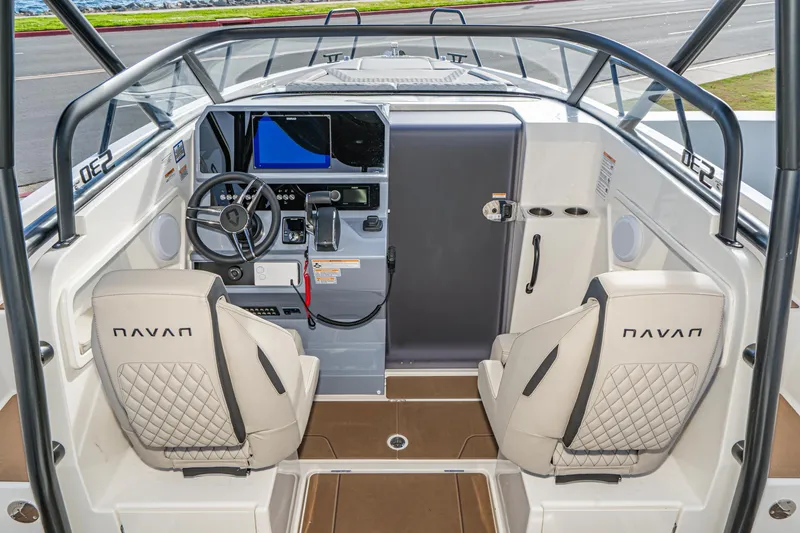 Slide: The Image of Interior of 2025 Navan S30 boat with modern dashboard and quilted seats. - 19