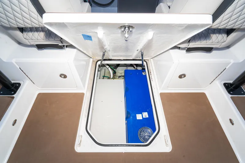 Slide: The Image of 2025 Navan S30 boat storage compartment with blue equipment inside. - 25