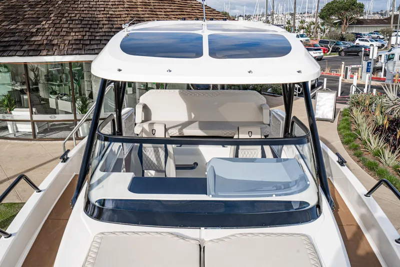 Slide: The Image of Navan S30 2025 boat with sleek design, docked at marina, showcasing modern features. - 26