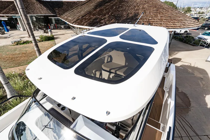 Slide: The Image of Navan S30 2025 yacht with sleek design and panoramic sunroof, docked at marina. - 27